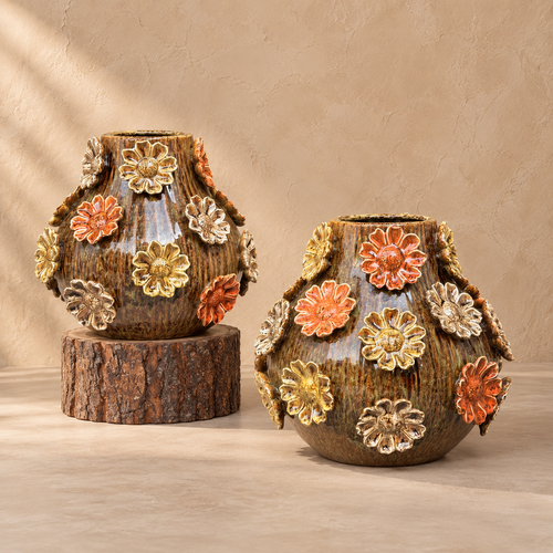 Two brown glazed ceramic vases with raised multicoloured 3D flowers displayed together.