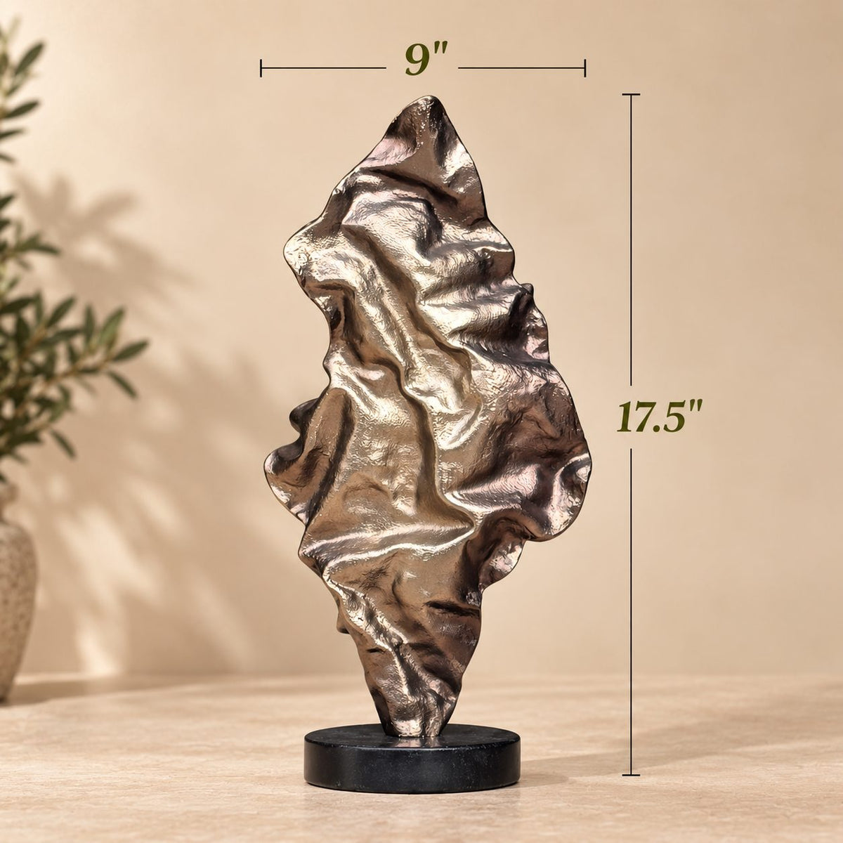 Dimension guide for the abstract metal sculpture measuring 17.5 inches in height and 9 inches in width.