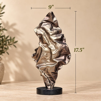 Dimension guide for the abstract metal sculpture measuring 17.5 inches in height and 9 inches in width.