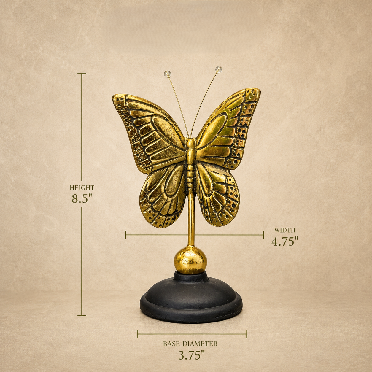 Dimensions guide of an antique brass butterfly figurine with an 8.5-inch height, 4.75-inch width, and 3.75-inch base diameter displayed on a luxury beige background by Inara Home Decor.