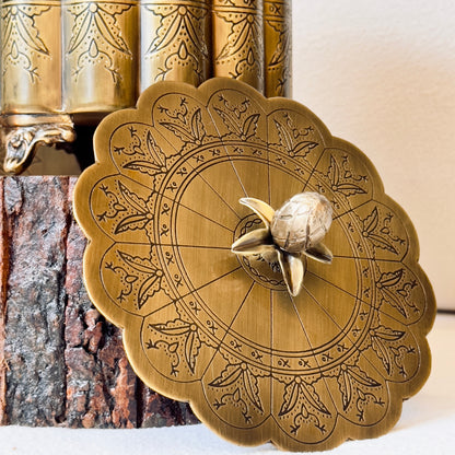 Antique gold brass keepsake box lid with intricate engraved round floral design, decorative brass storage container detail for luxury home décor and gifting