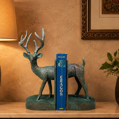 Luxury deer bookends displayed on a premium console table with a decorative book, warm lighting, and a beige Venetian plaster wall, creating an elegant luxury home décor setting.