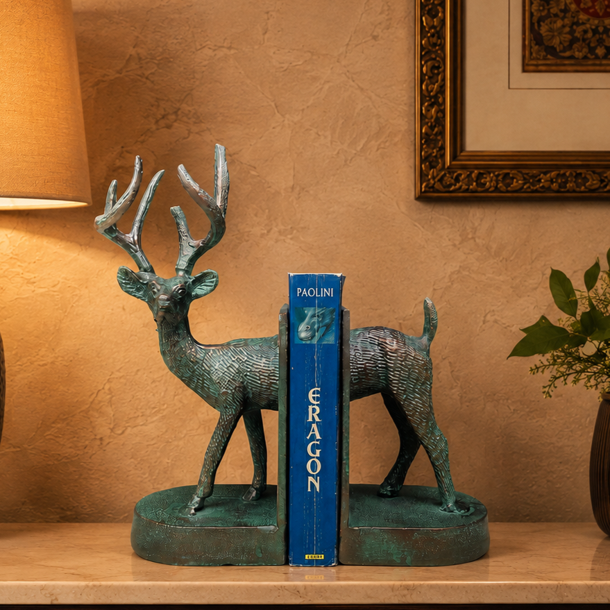 Luxury deer bookends displayed on a premium console table with a decorative book, warm lighting, and a beige Venetian plaster wall, creating an elegant luxury home décor setting.