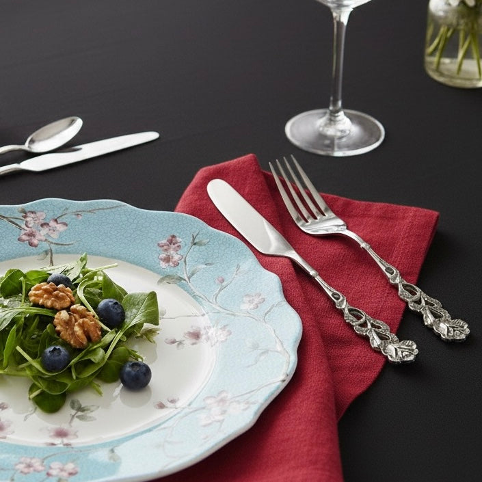 Antique rose table forks with detailed embossed brass handles
