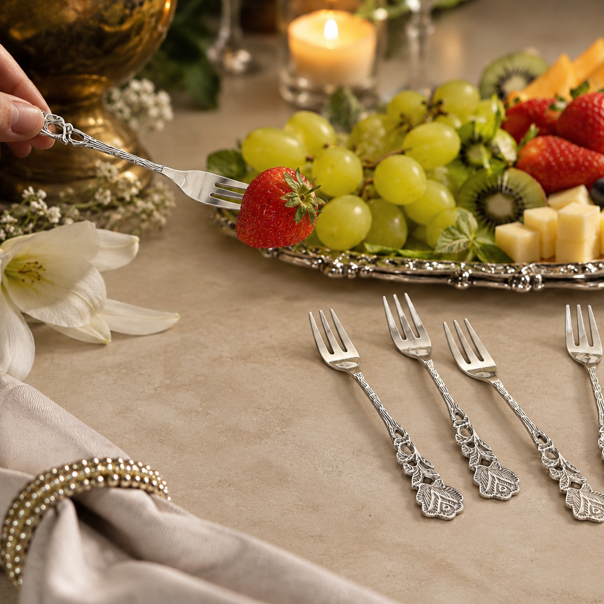 Antique Rose dessert forks set of 6 in premium stainless steel with decorative floral handles, elegantly styled with fresh fruits on a warm beige Venetian seamless matte microcement tabletop for luxury dining and home décor.