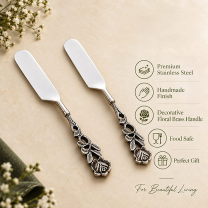 Antique Rose stainless steel cake knife set with decorative floral metal handles displayed on a warm beige background, highlighting premium stainless steel, handmade finish, food-safe construction, and elegant gift-worthy design.