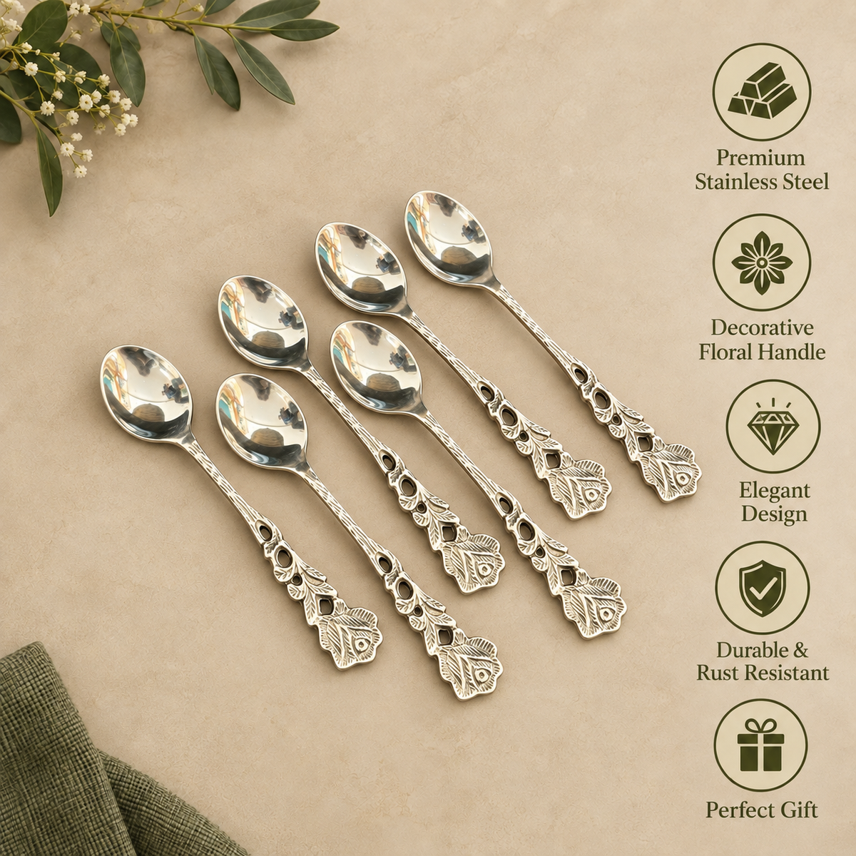 Antique silver floral handle stainless steel dessert spoon set of 6 displayed on a warm beige textured surface with elegant decorative icons, featuring durable rust-resistant premium stainless steel and ornate vintage floral handles.