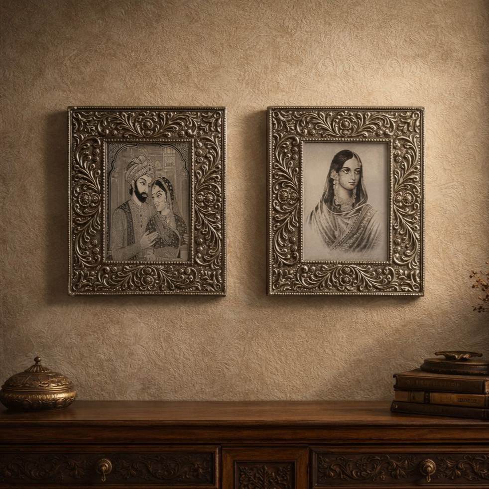 Antique silver handcrafted photo frames mounted on a textured royal wall above a vintage wooden console, styled in a luxury Indian heritage living room with soft natural daylight and elegant shadows