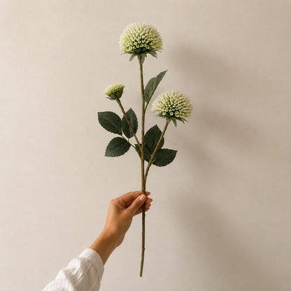 Single artificial white dahlia stem with realistic layered bloom and lifelike green foliage, ideal for premium floral arrangements and home décor.