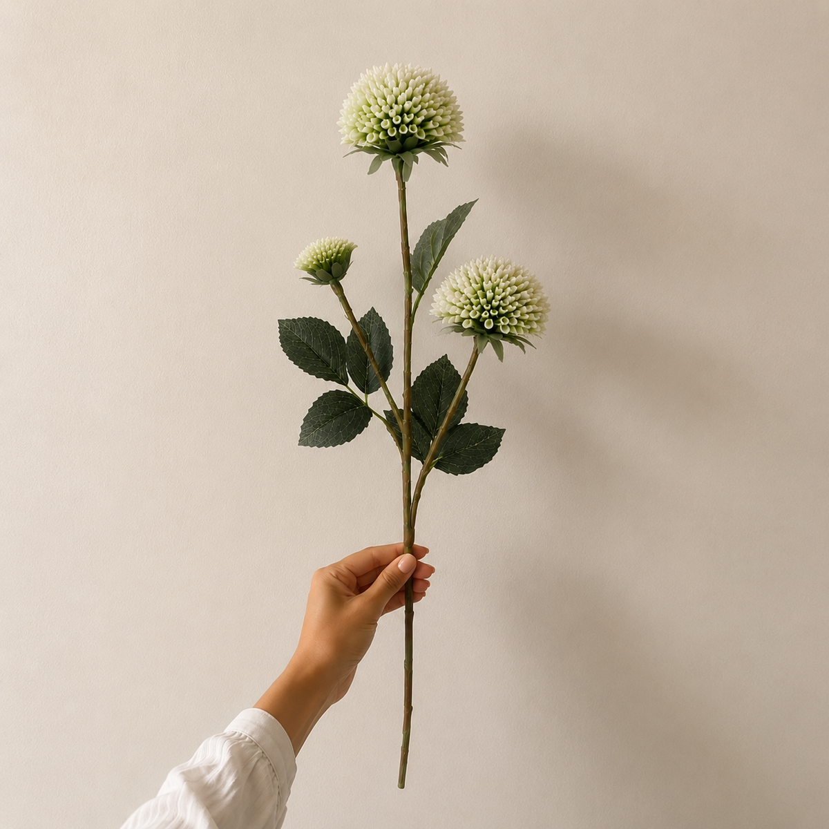 Single artificial white dahlia stem with realistic layered bloom and lifelike green foliage, ideal for premium floral arrangements and home décor.