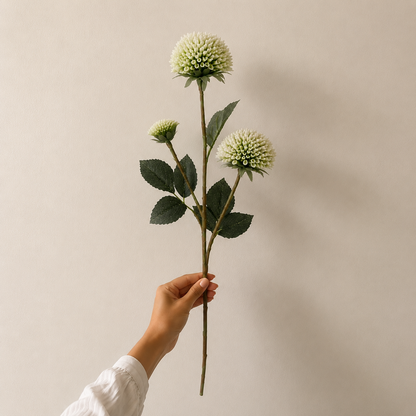Single artificial white dahlia stem with realistic layered bloom and lifelike green foliage, ideal for premium floral arrangements and home décor.