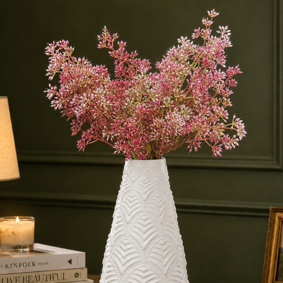 Artificial Pink Star Cluster Stem arranged in a white textured vase, creating an elegant luxury home décor display.