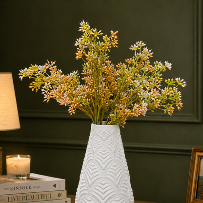 Artificial orange filler stems beautifully arranged in a textured white vase, creating a warm and elegant floral display for modern home interiors.