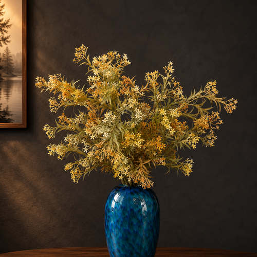 Artificial Flower Asparagus Stems Rust arranged in a blue glass vase, creating a warm and elegant floral display for luxury home interiors.