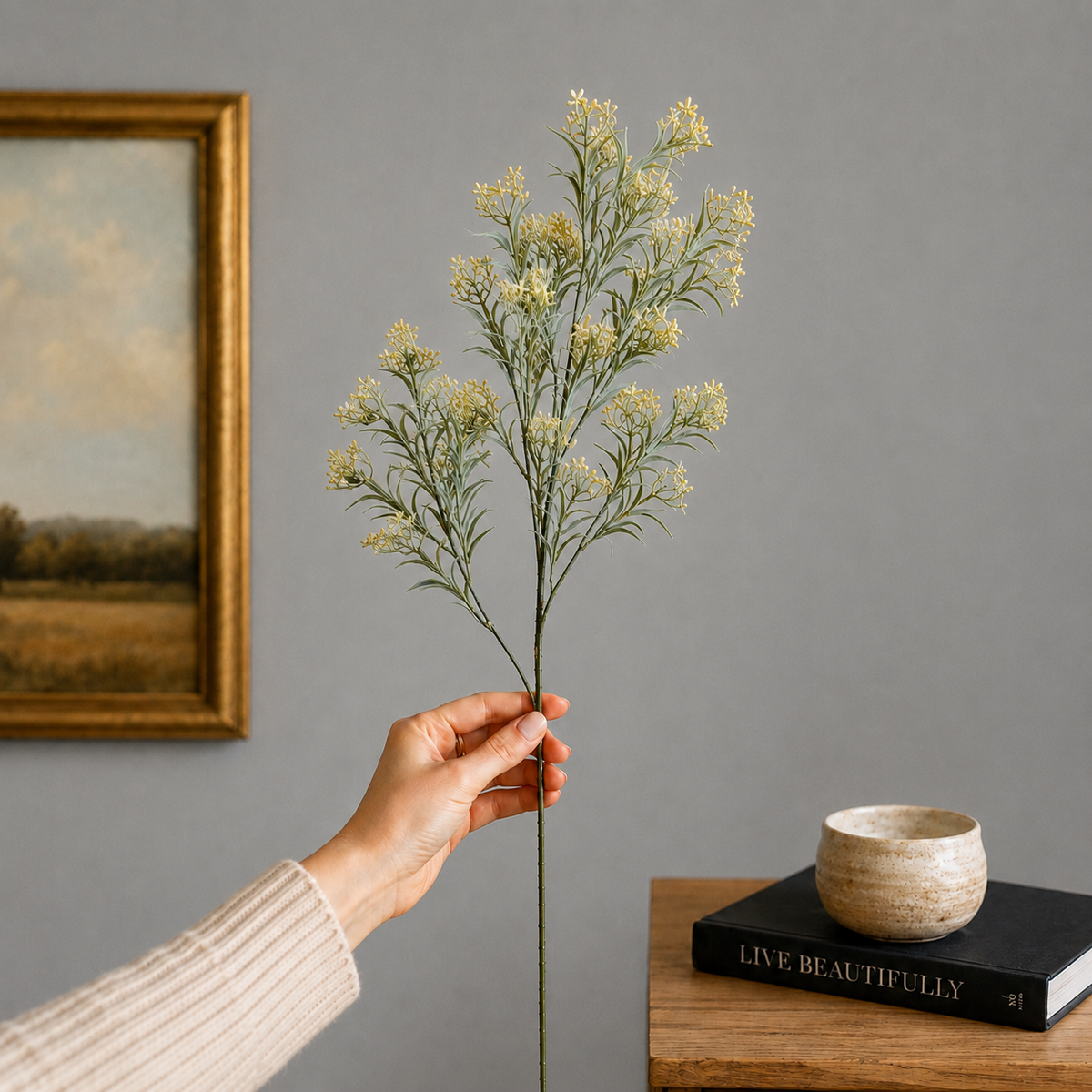 Artificial white wildflower stem with realistic green foliage, premium faux floral branch for elegant home décor by Inara Home Decor.