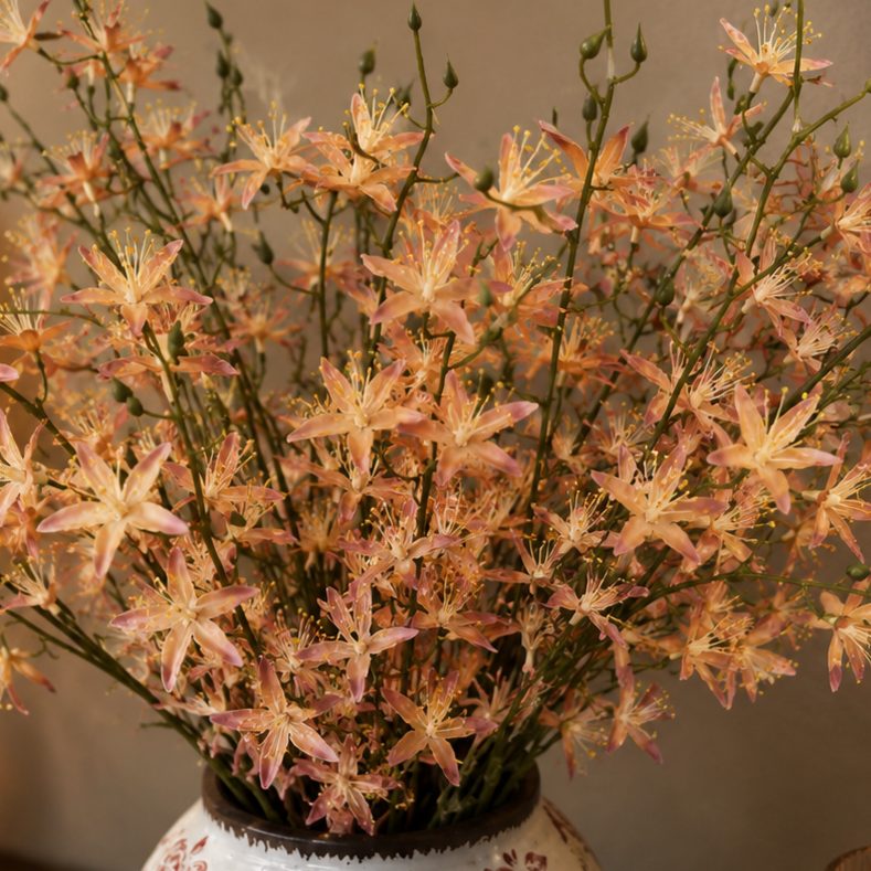 Close-up of artificial peach wildflowers featuring realistic petals and buds, ideal for premium floral arrangements and home decoration.