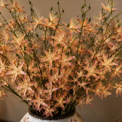 Close-up of artificial peach wildflowers featuring realistic petals and buds, ideal for premium floral arrangements and home decoration.