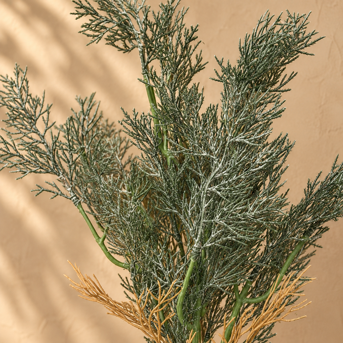 Close-up of the Artificial Green Foliage Bunch featuring realistic needle-like textured leaves with natural green and earthy tones.