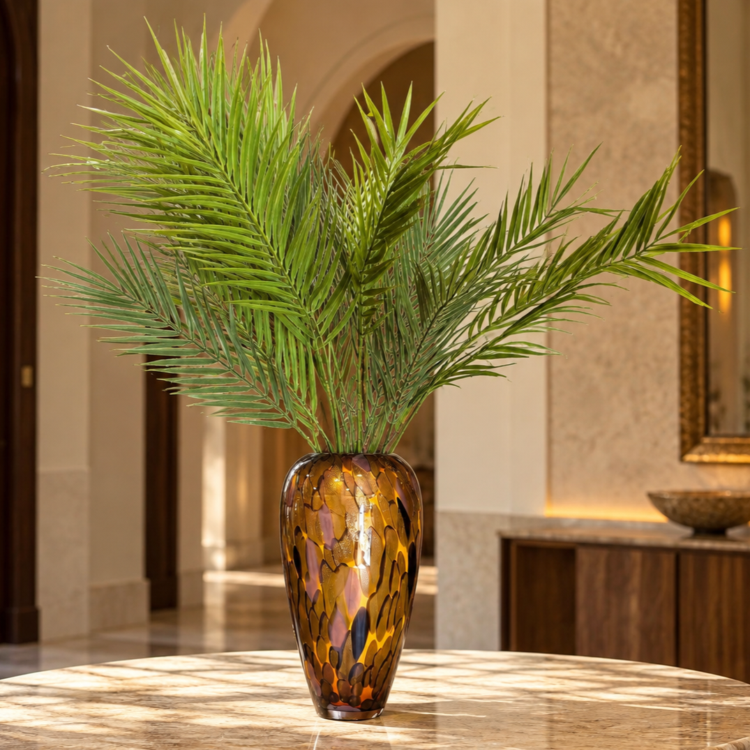 Artificial Palm Foliage Bunch displayed in an amber glass vase for elegant tropical interior styling and luxury home décor.