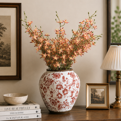 Artificial pink wildflower stems displayed in a decorative ceramic vase, creating a premium luxury home décor arrangement.