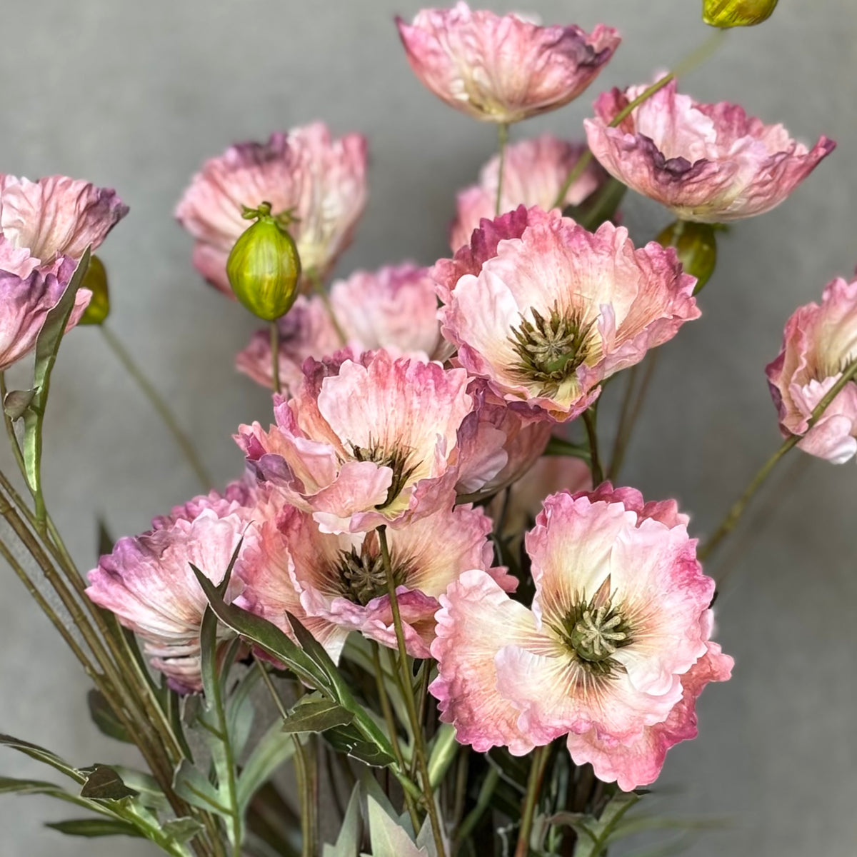 Close-up of realistic Artificial Poppy Pink flowers with delicate petals and lifelike details.