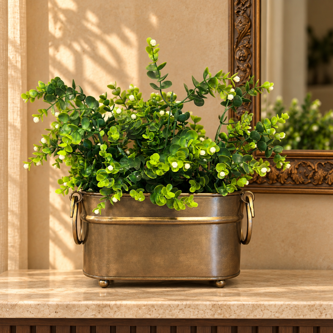 Artificial white berry eucalyptus foliage bunch arranged in a vintage metal planter for elegant home décor styling.