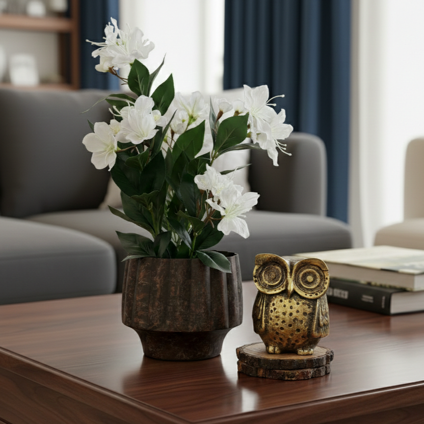 Artificial white cherry blossom plant styled on a coffee table to add timeless elegance to a modern living room.
