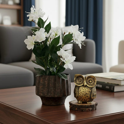 Artificial white cherry blossom plant styled on a coffee table to add timeless elegance to a modern living room.