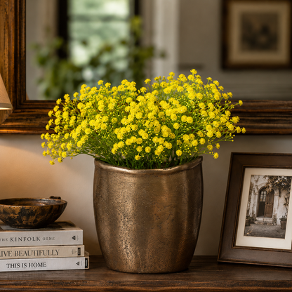 Artificial Yellow Baby's Breath stems styled in a decorative brass planter, creating a bright and elegant home décor arrangement.