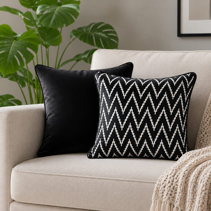 Black chevron throw lifestyle cushion cover ob a beige sofa of a living room