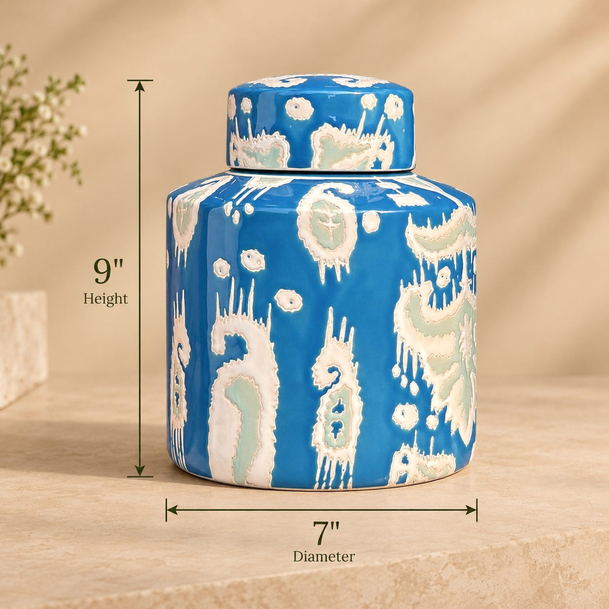 Dimensions of handcrafted blue ceramic decorative jar measuring 9 inches in height and 7 inches in diameter.
