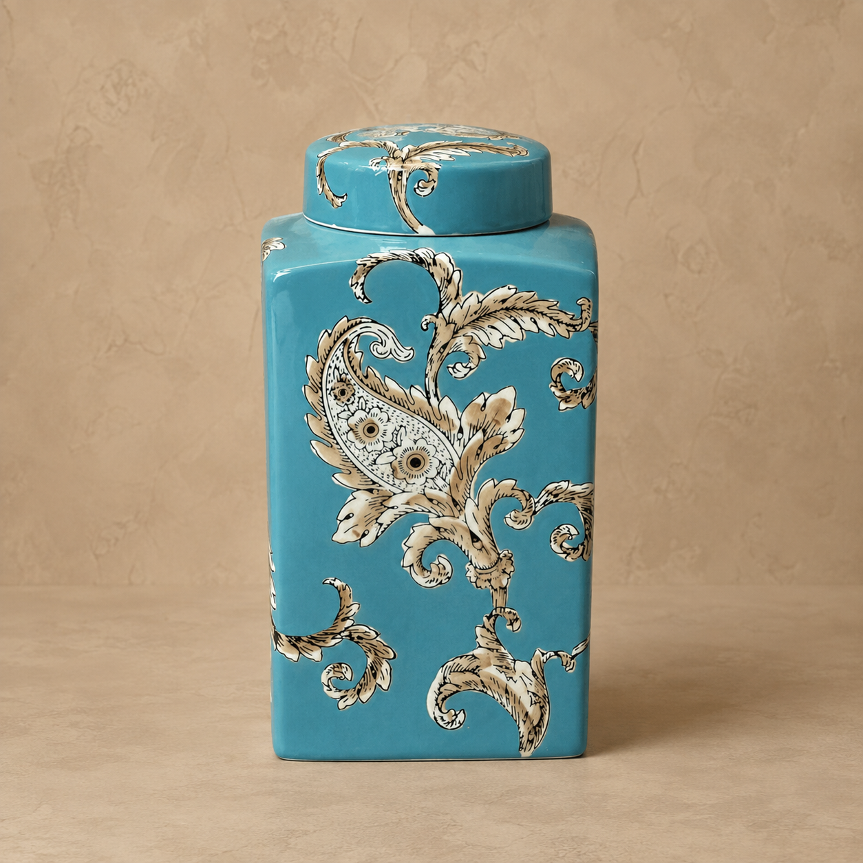 Blue hand-painted ceramic decorative jar with glossy finish featuring elegant floral paisley artwork for luxury home décor.