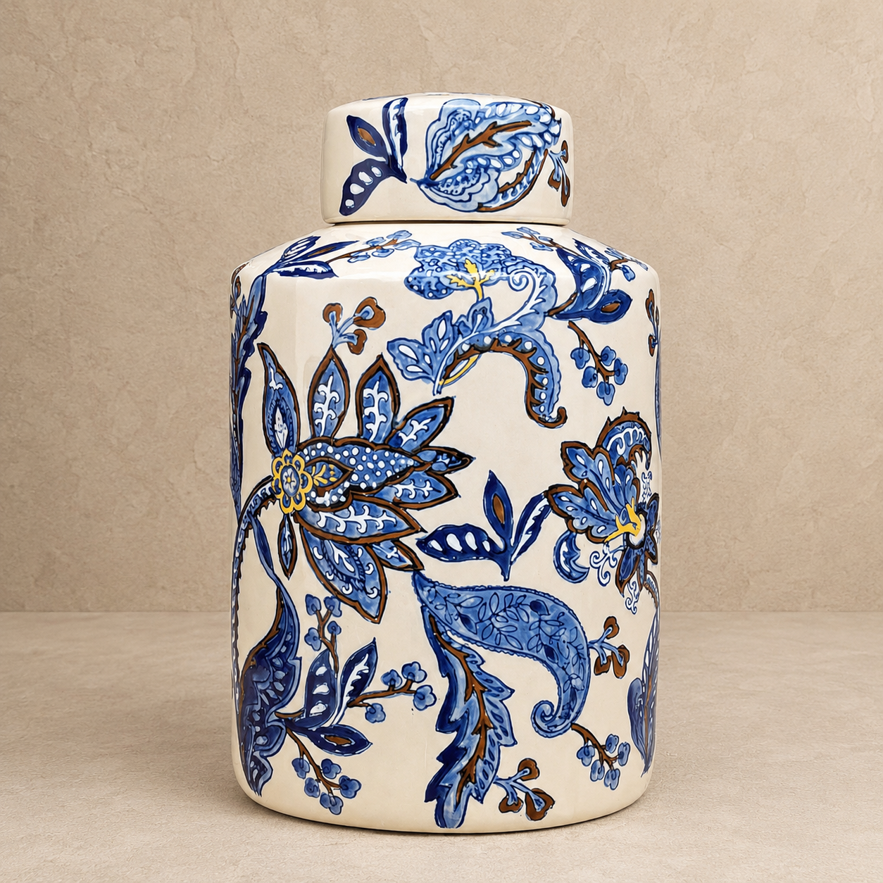 Blue and white hand-painted ceramic decorative jar with lid featuring intricate floral artwork, luxury home décor by Inara Home Decor.
