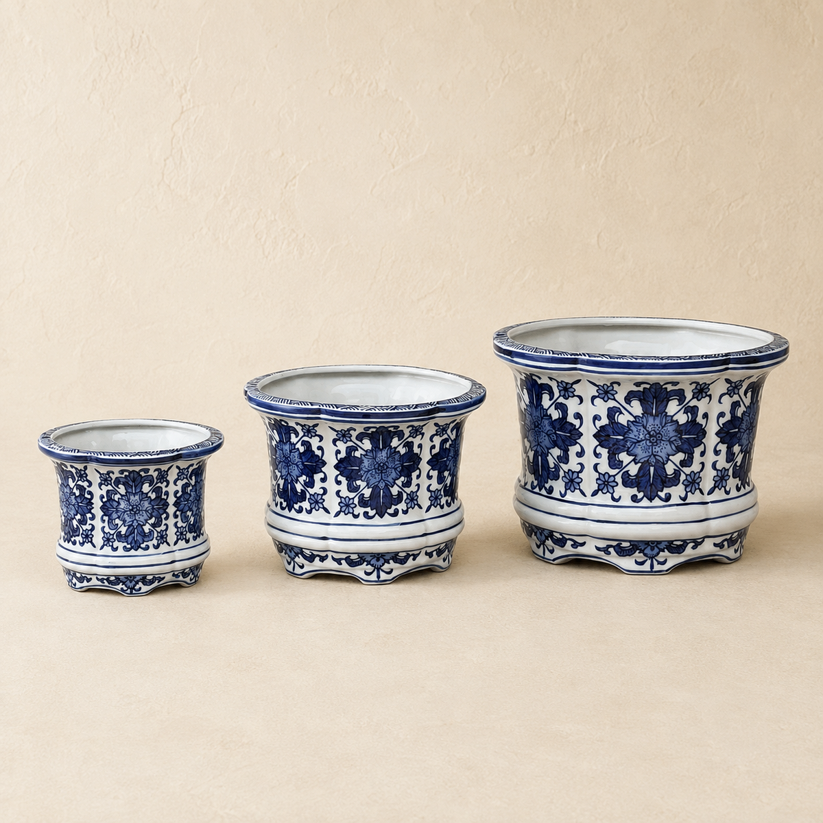 Luxury blue and white porcelain planter set in small, medium, and large sizes featuring a hand-painted floral design for elegant indoor home décor.