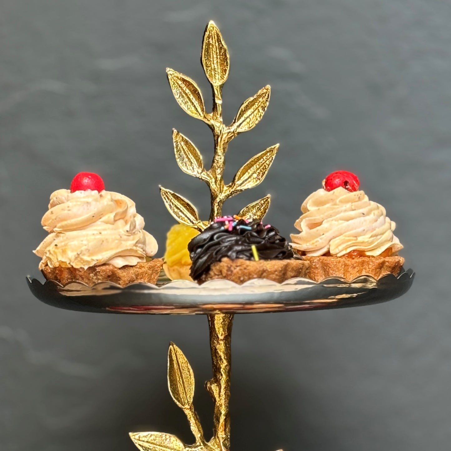 Luxury tabletop accessory with aluminum cast brass plating on leaf details.