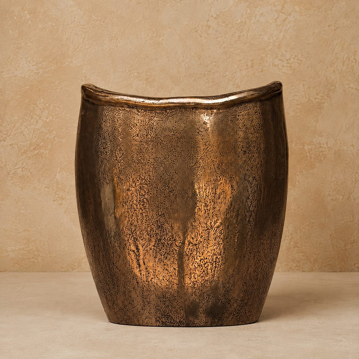Antique bronze handcrafted metal decorative vase with textured finish for luxury home décor.