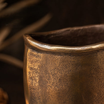 Close-up of the handcrafted antique bronze metal vase showcasing its textured finish and artisan craftsmanship.