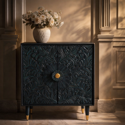 Classic teal handcarved wooden sideboard cabinet styled with textured vase and fresh flowers in a refined traditional interior.