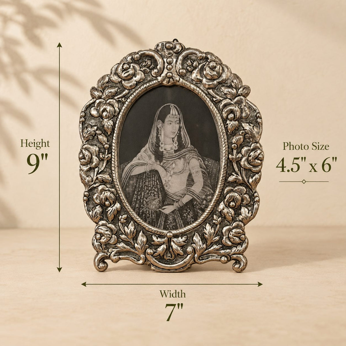 Dimensions of the Florence Heirloom antique silver oval photo frame measuring 9 inches high, 7 inches wide, suitable for a 4.5 x 6 inch photograph.