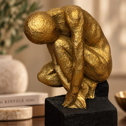 Close-up of luxury gold abstract human sculpture showcasing handcrafted textured finish and contemporary artistic design.