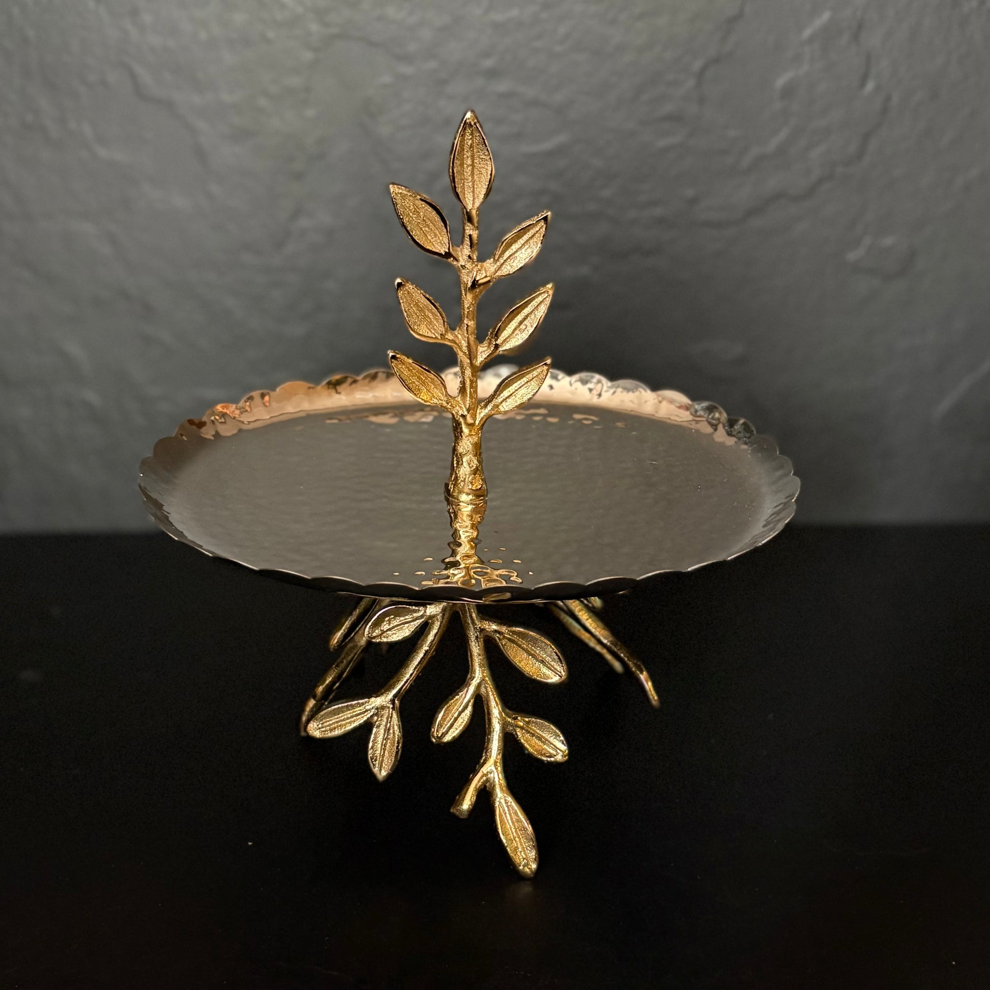 Elegant gold two tier dessert stand with leaf handle and scalloped trays