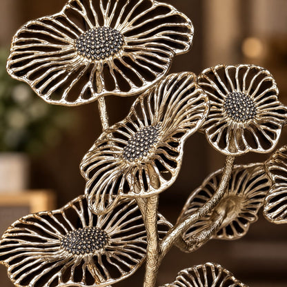 Close-up of handcrafted gold metal floral sculpture showcasing intricate flower petals and premium artisan craftsmanship.