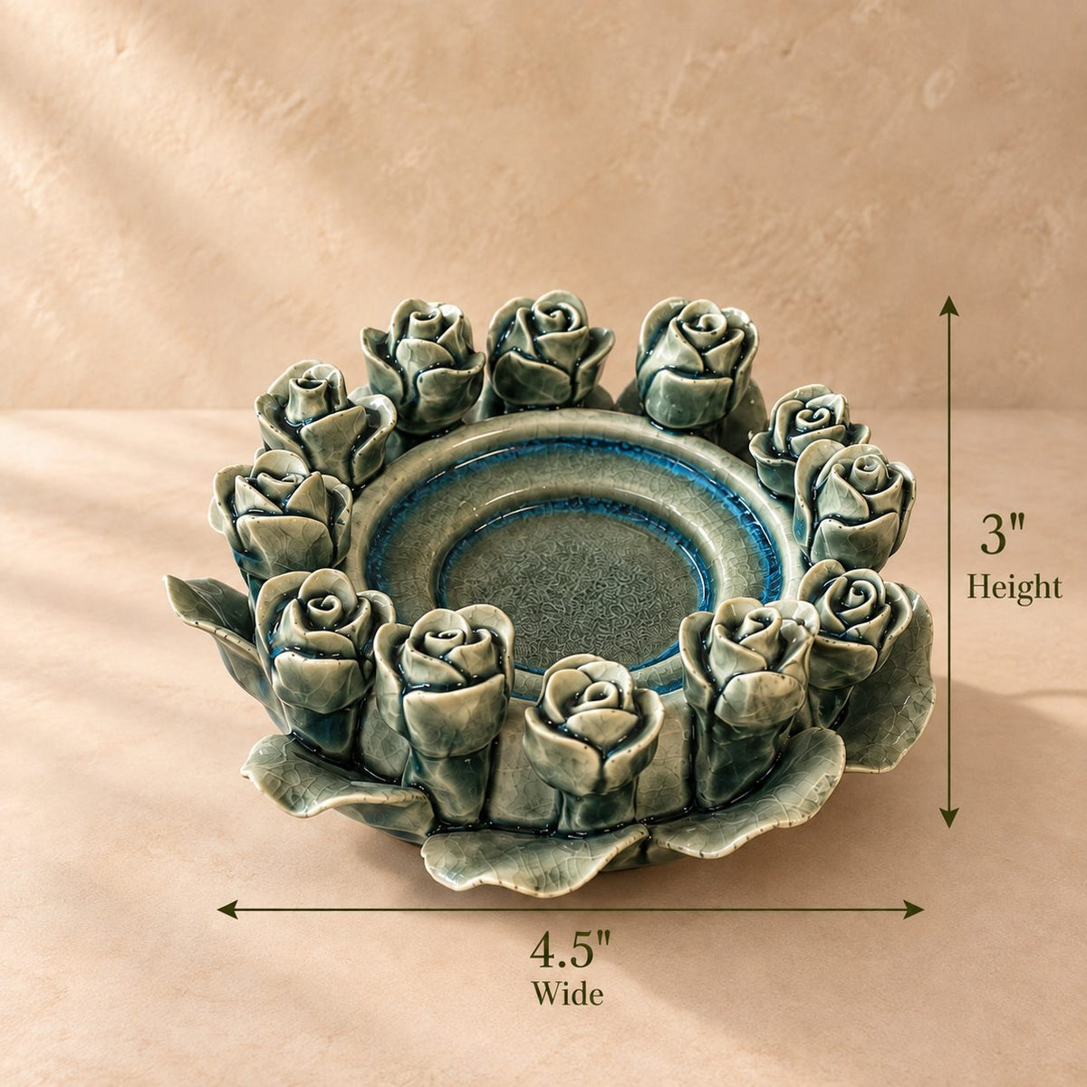 Dimension guide for the handcrafted green ceramic rose tealight holder showing 4.5-inch width and 3-inch height with elegant measurement arrows.