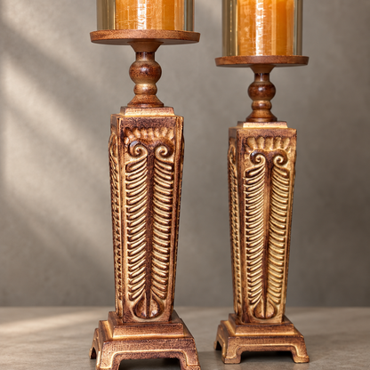 Close-up of the intricate hand-carved detailing and antique bronze finish on a premium wooden hurricane candle holder with glass shade.