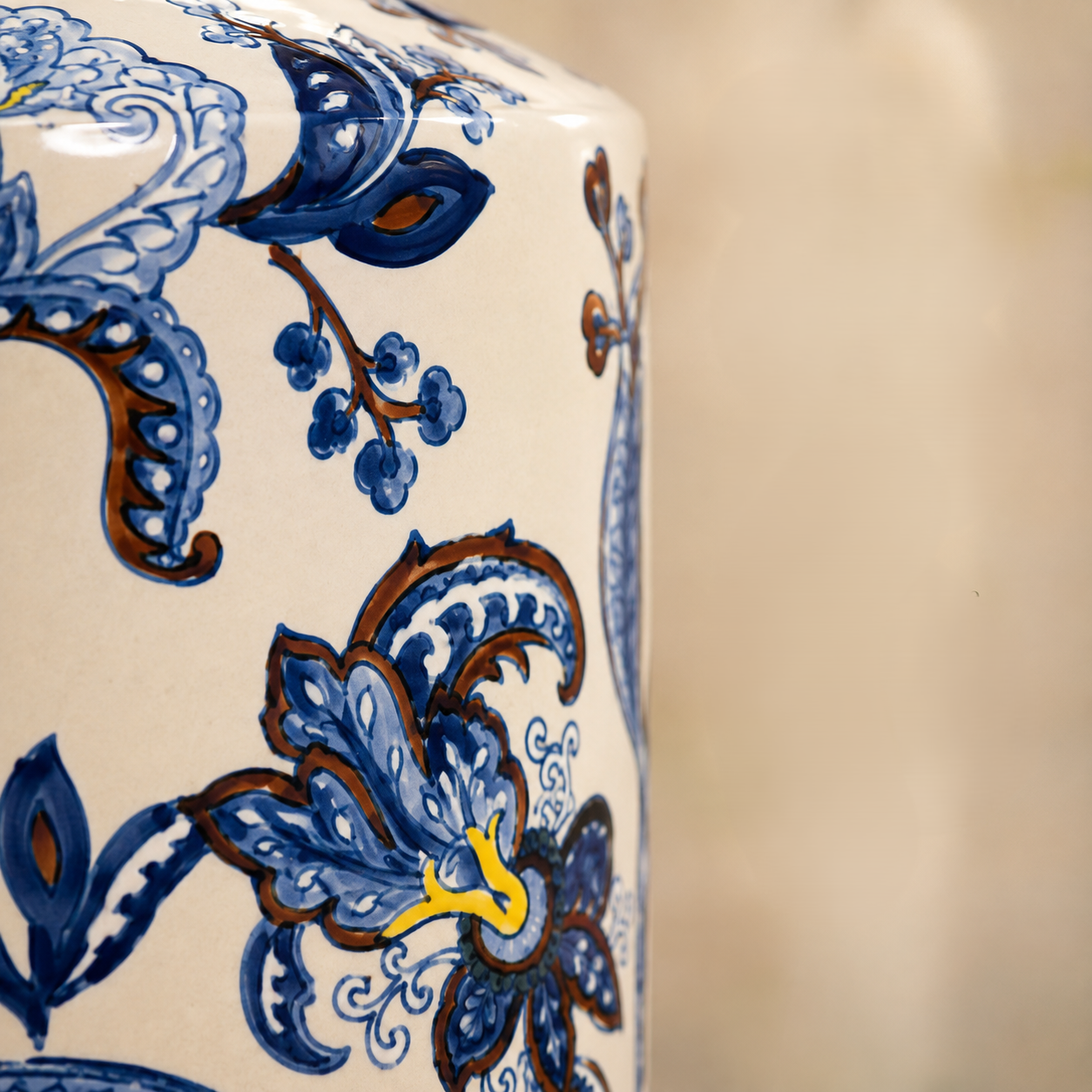 Close-up of the intricate hand-painted blue floral artwork and premium glossy ceramic finish on a decorative porcelain jar.