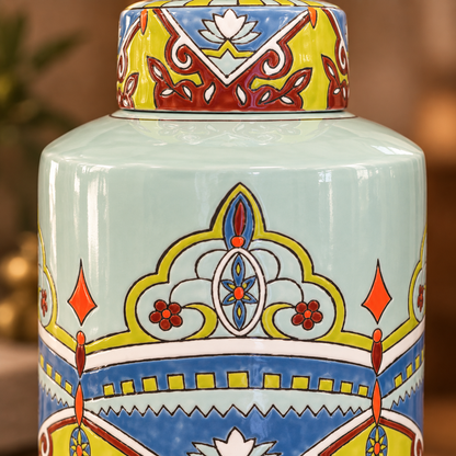 Close-up of a hand-painted ceramic ginger jar showcasing intricate artisan floral patterns, glossy finish, and vibrant blue, green, yellow, and red detailing.