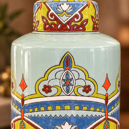 Close-up of a hand-painted ceramic ginger jar showcasing intricate artisan floral patterns, glossy finish, and vibrant blue, green, yellow, and red detailing.