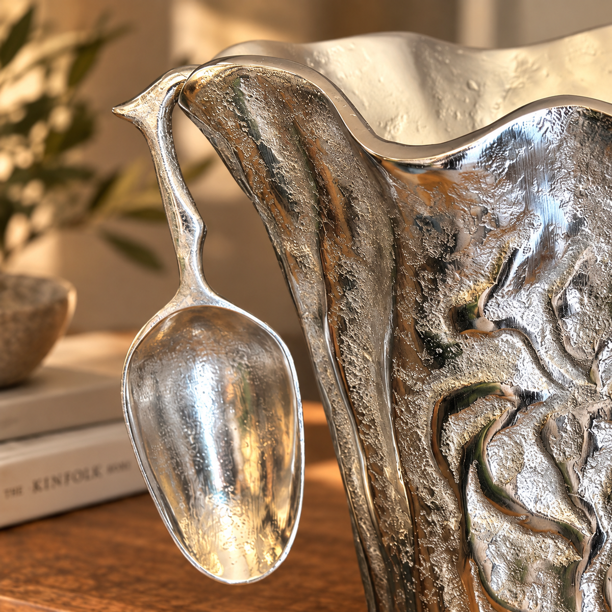 Close-up of the handcrafted aluminium ice bucket showing textured finish and matching scoop with premium artisan craftsmanship.