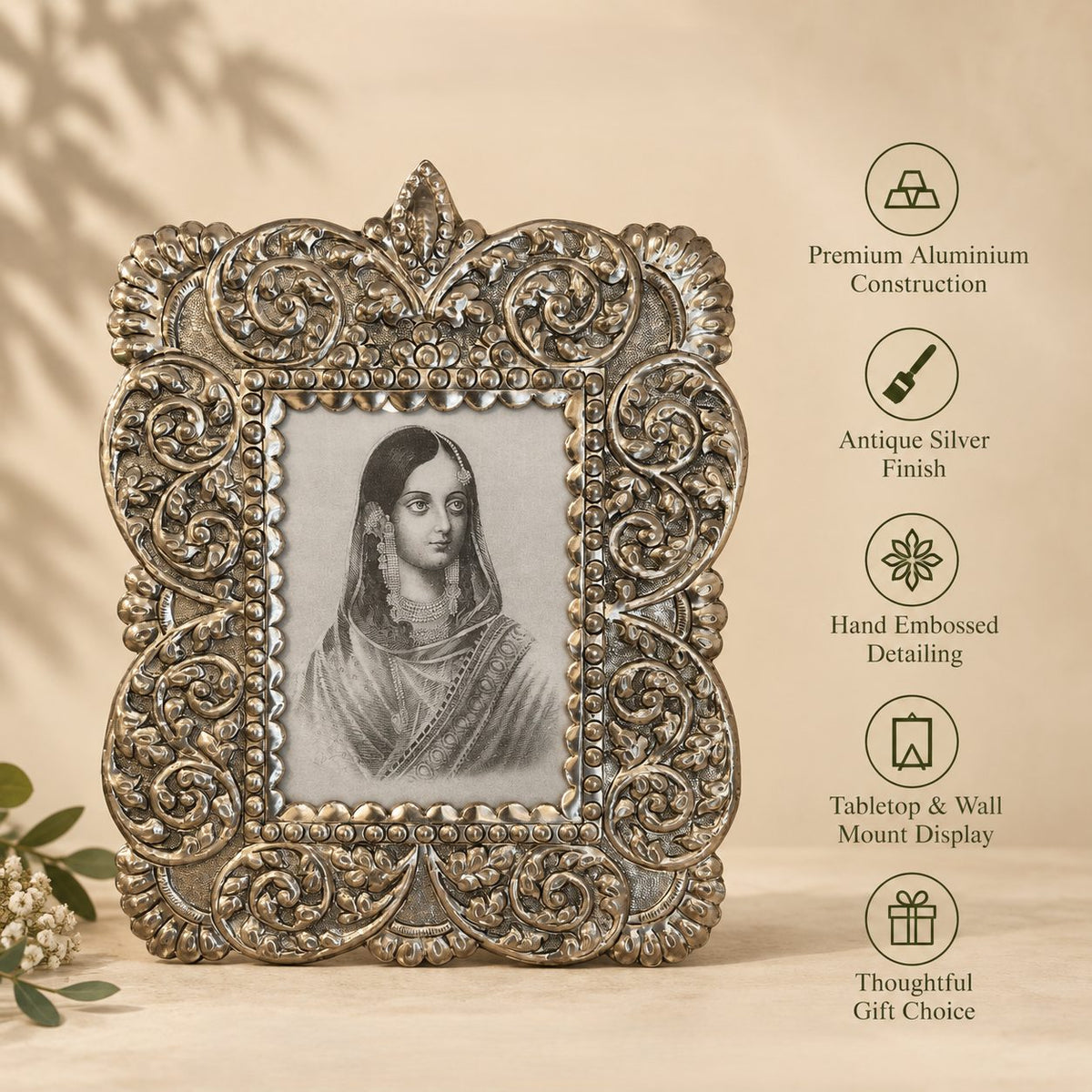 Antique silver photo frame with feature icons: aluminium build, hand-embossed detail, wall or table display.