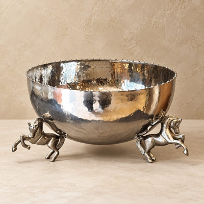 Luxury silver hammered decorative metal bowl with sculptural horse legs, handcrafted statement centerpiece for dining tables and home décor.